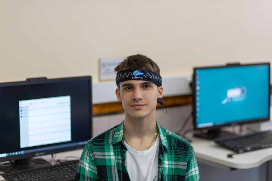 EEG tracing on hospital monitor with neurologist reviewing chart