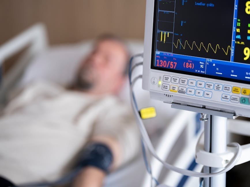 Hospital emergency room with monitors and IV equipment ready for a critical patient