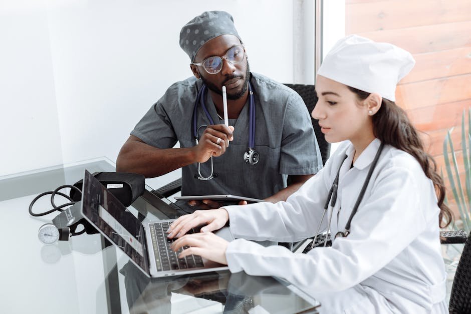 Multidisciplinary medical team conferencing about a patient's care plan in a hospital meeting room