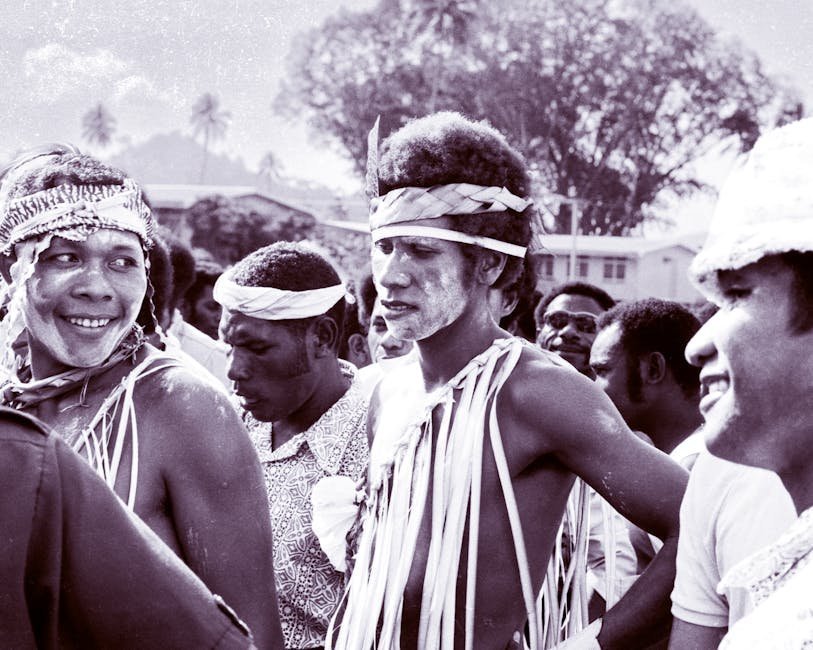 Two-Spirit Pride gathering with traditional regalia and rainbow flag