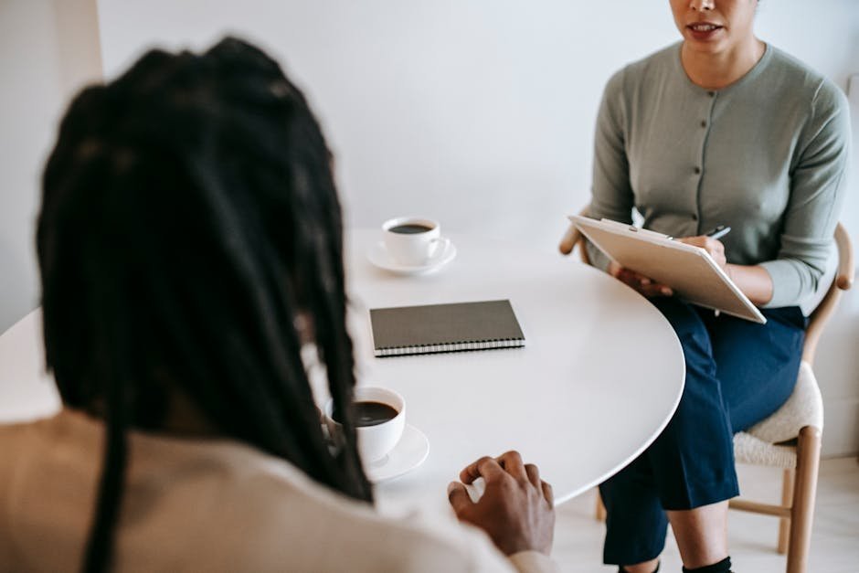 Therapist and client meeting in community mental health clinic office