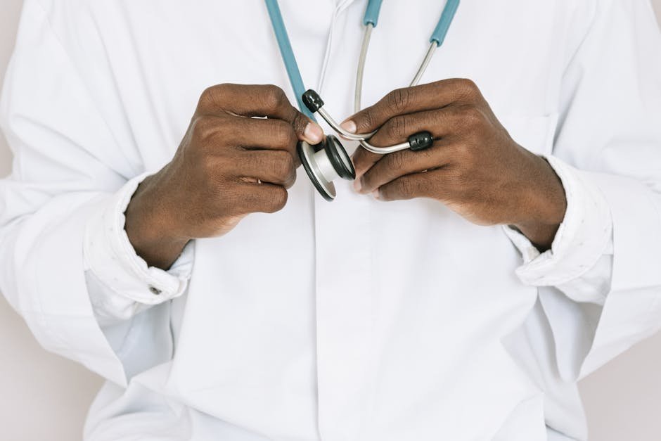 Primary care physician using AUDIT screening tool with patient during office visit
