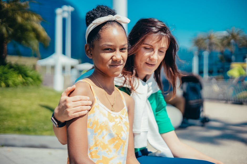 Therapeutic foster parent supporting adolescent with mental health binder during home visit