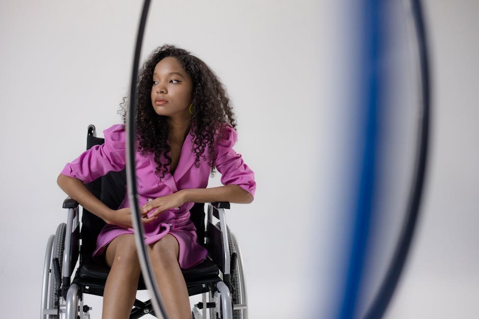 Disabled woman in wheelchair speaking with affirming therapist in accessible office