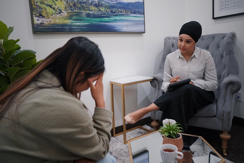 Refugee family in mental health intake session with interpreter at resettlement agency