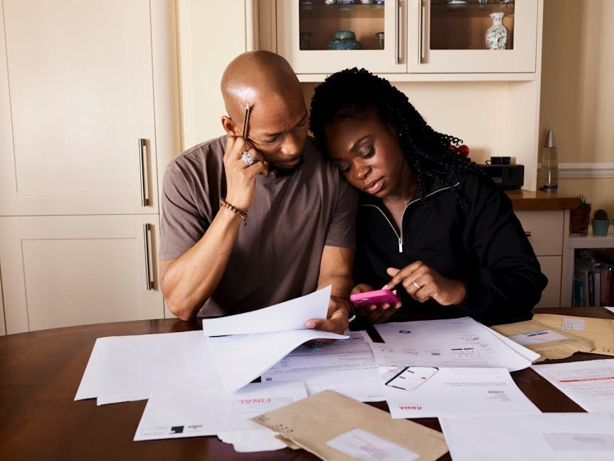 Family reviewing healthcare bills and out-of-pocket maximum calculations at home