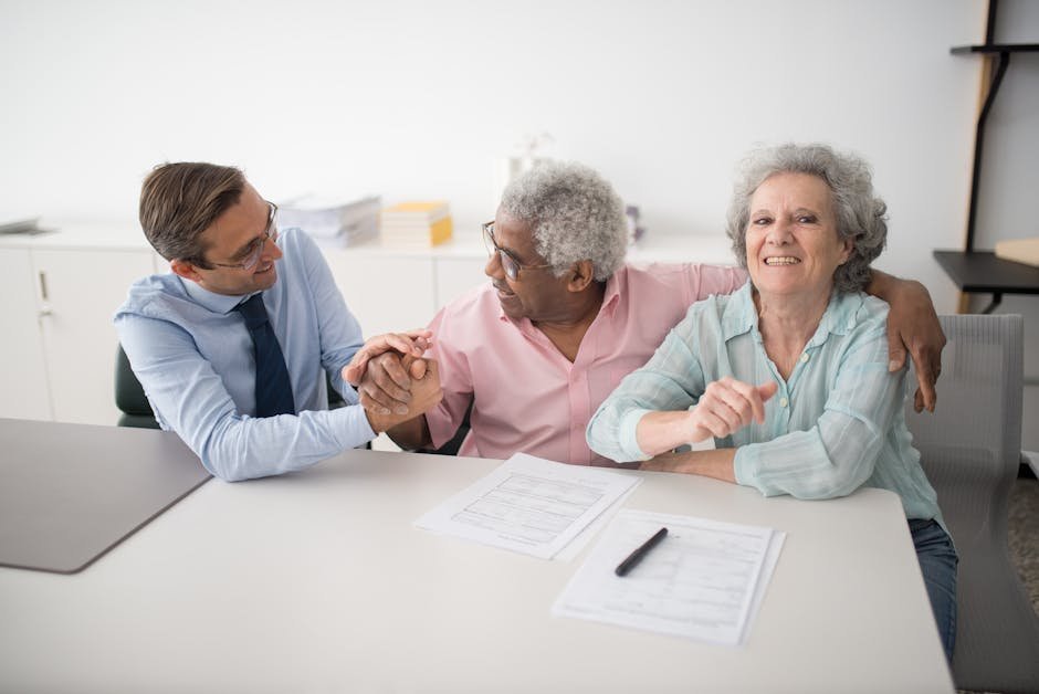 Family discussing two insurance cards and coordination of benefits paperwork at kitchen table