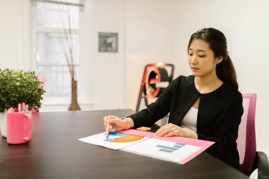 HR professional in a private office reviewing workplace mental health crisis protocols on a tablet
