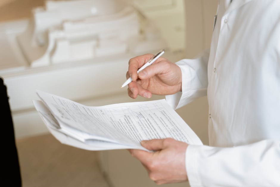 Addiction medicine clinician reviewing a withdrawal assessment scale with a hospitalized patient