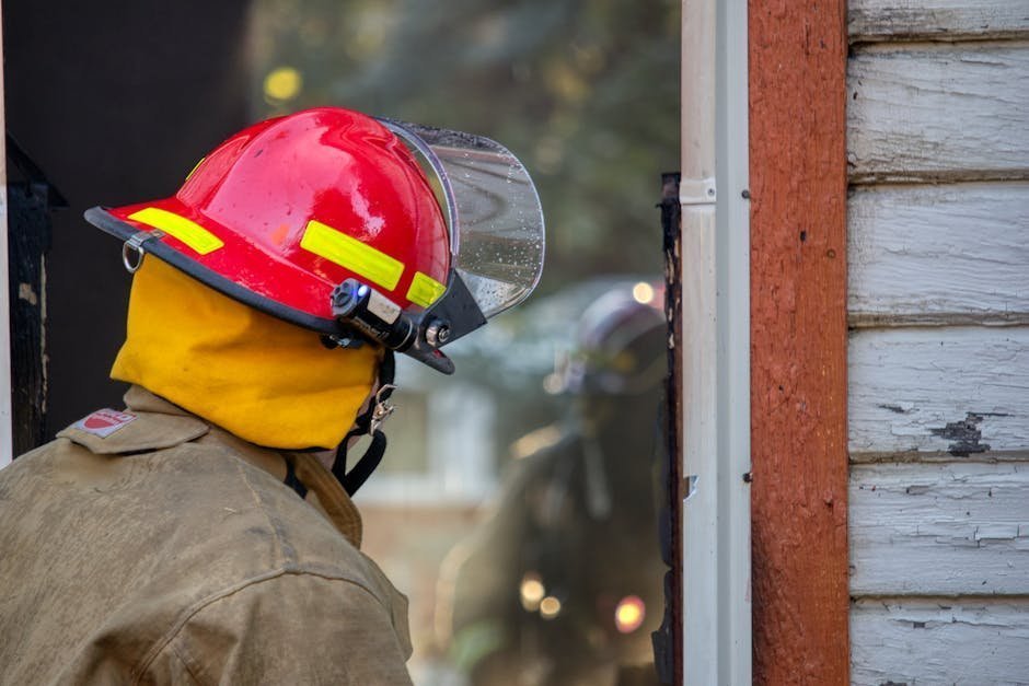 Firefighter sitting in therapy office speaking with first responder mental health clinician