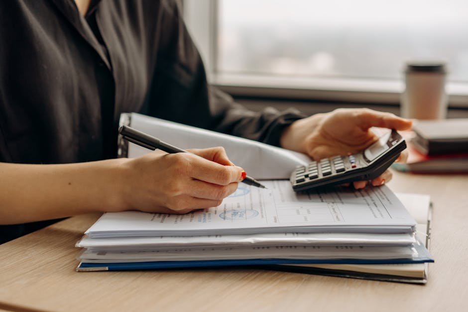 Therapist office with calculator and intake paperwork on the desk