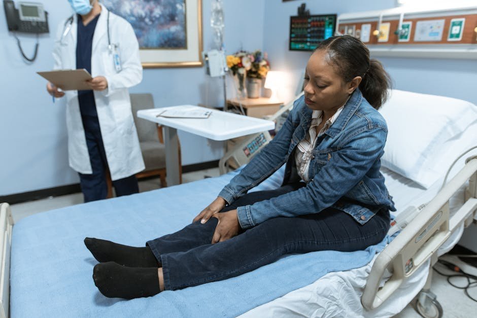 Hospital consultation room with physician and patient discussing serious treatment decision