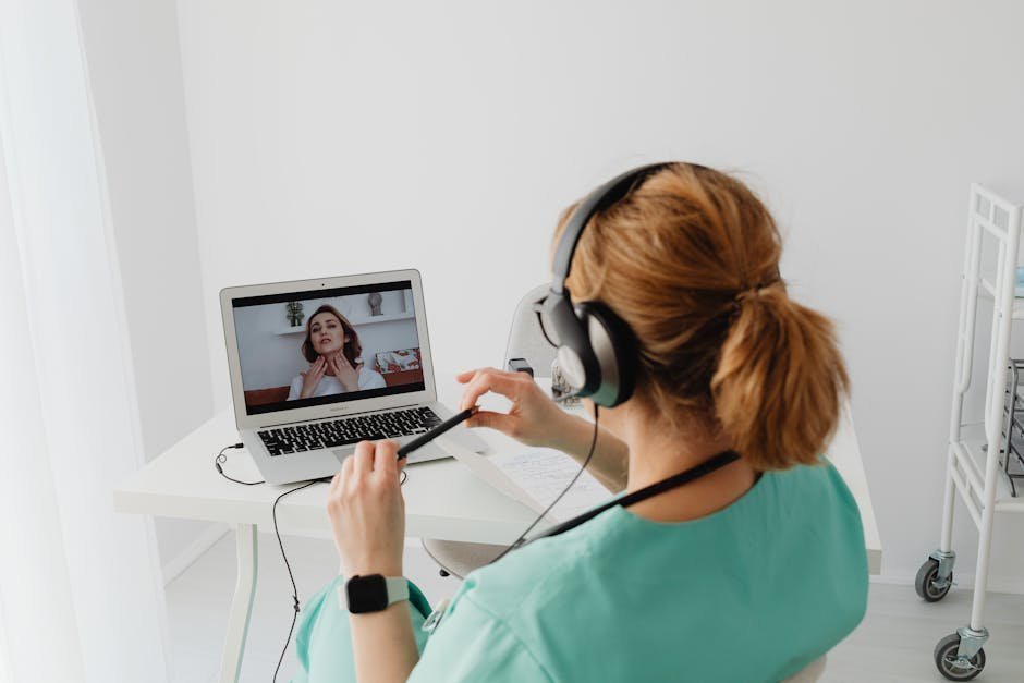 Telehealth video consultation between PMHNP and patient with prescription pad visible