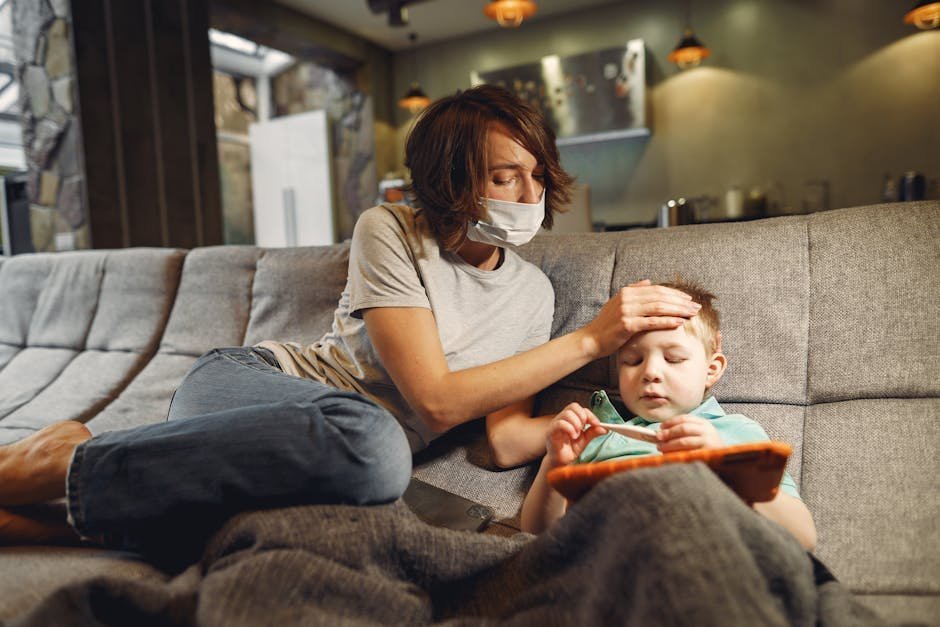 Worried mother sitting on couch comforting teenage son in living room evening light