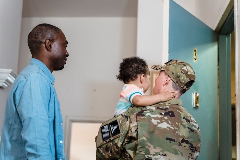 Military family at home reviewing TRICARE benefits paperwork together at the kitchen table
