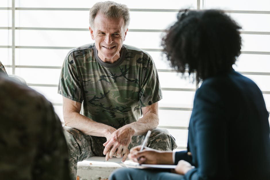 Veteran in private therapy session with clinician at trauma treatment clinic