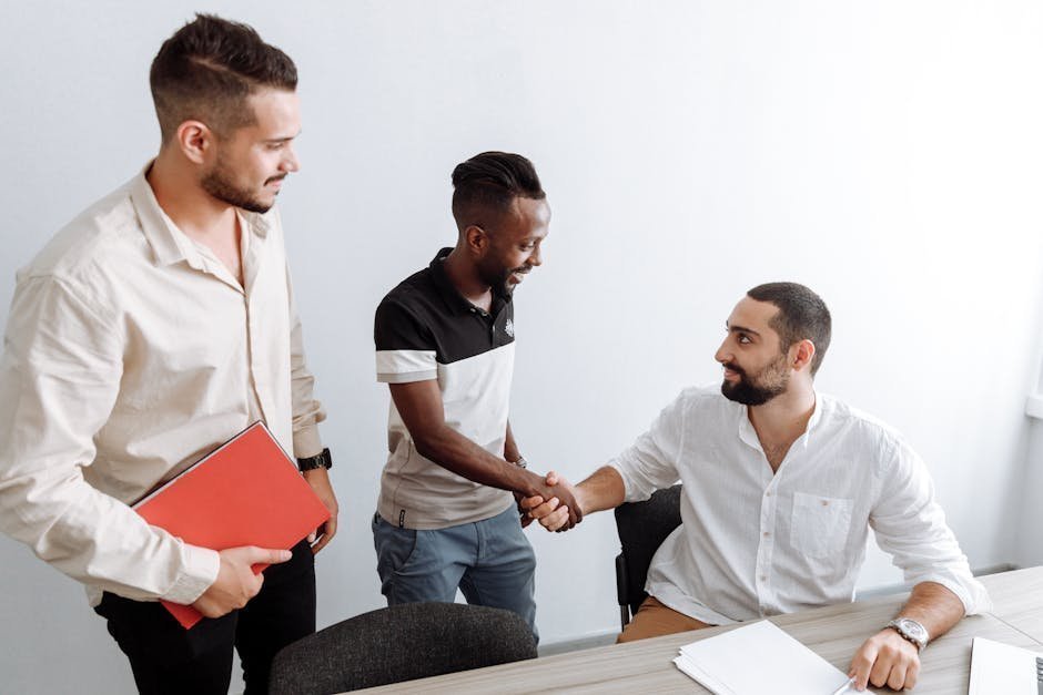 Young man meeting with a multidisciplinary first-episode psychosis team in a brightly lit clinic