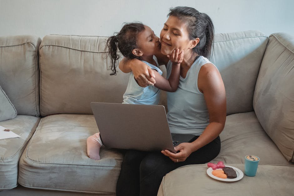 Mother sitting on couch in quiet home after children left