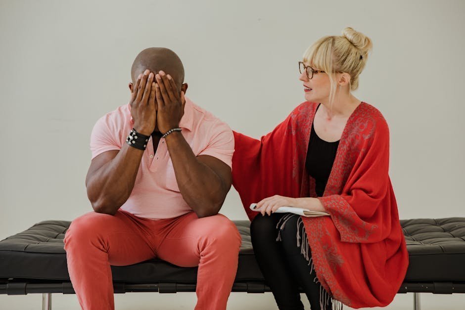 Black woman in therapy session with empathetic Black female therapist